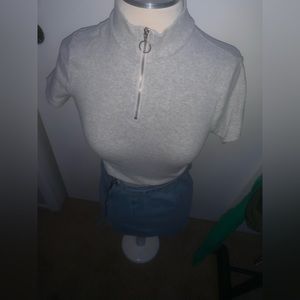 turtle neck and jean skirt.